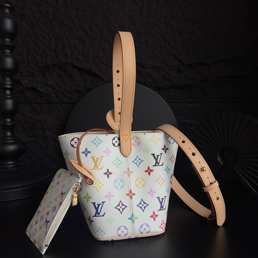 Louis Vuitton monogram bucket bag with tan top handle and side zipper pouch