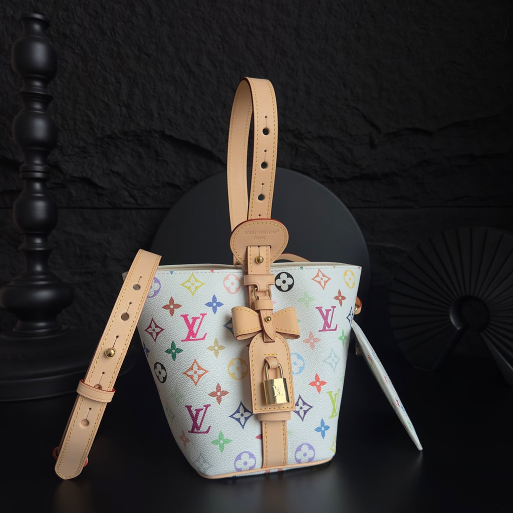 Louis Vuitton monogram bucket bag with tan top handle and colorful logo print