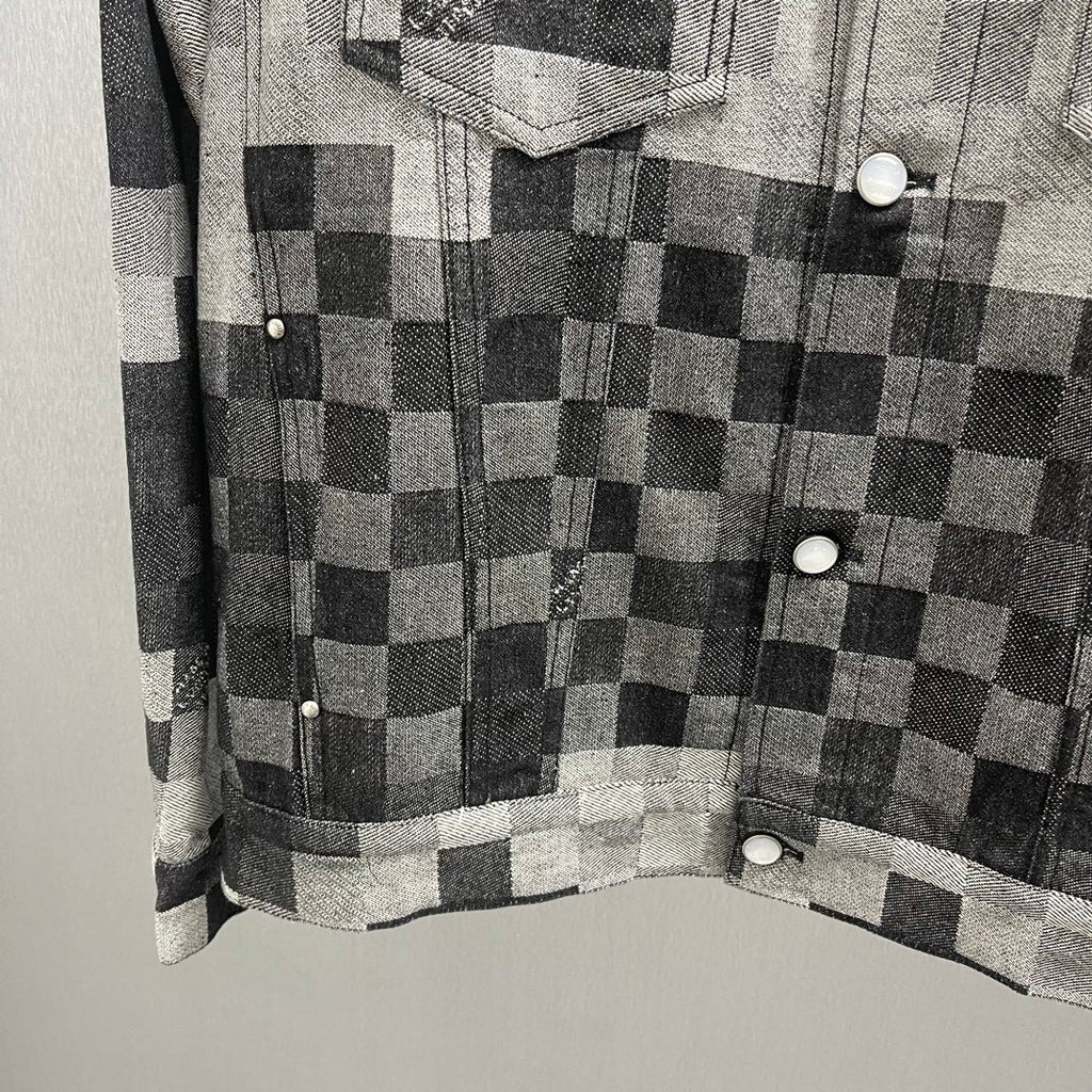 Checkered denim jacket with button front, chest pocket, and long sleeves