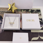 Dior necklace displayed in a white presentation box with DIOR logo