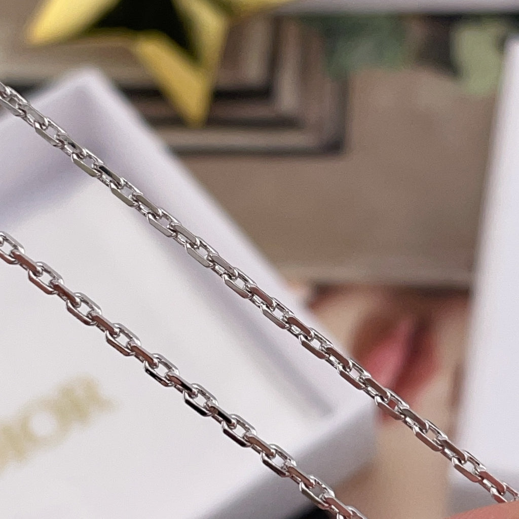 Dior necklace chain links in silver tone, close-up