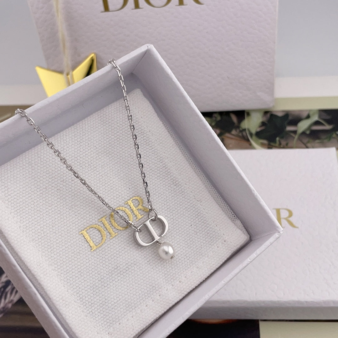 Dior necklace with silver chain and pendant charm in a white gift box