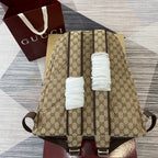 Gucci men's mini backpack in beige GG pattern, rear view with adjustable shoulder straps