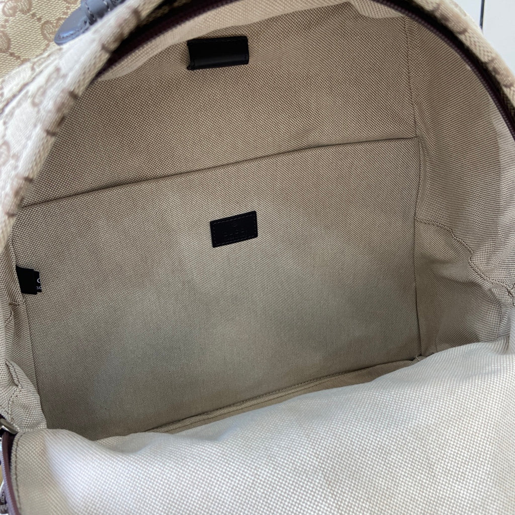 Gucci men's mini backpack interior lining in beige with small black label