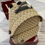 Gucci mini backpack with top handle, GG canvas exterior and leather corner trim