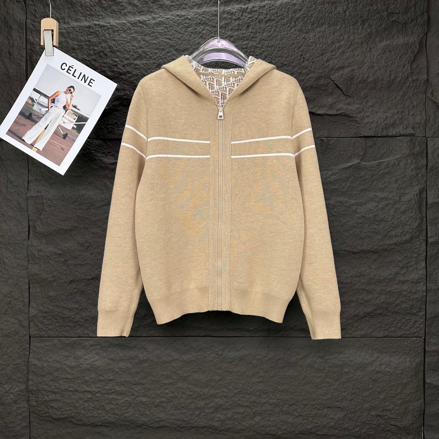 Beige long-sleeve zip hoodie with striped detail across chest and hood