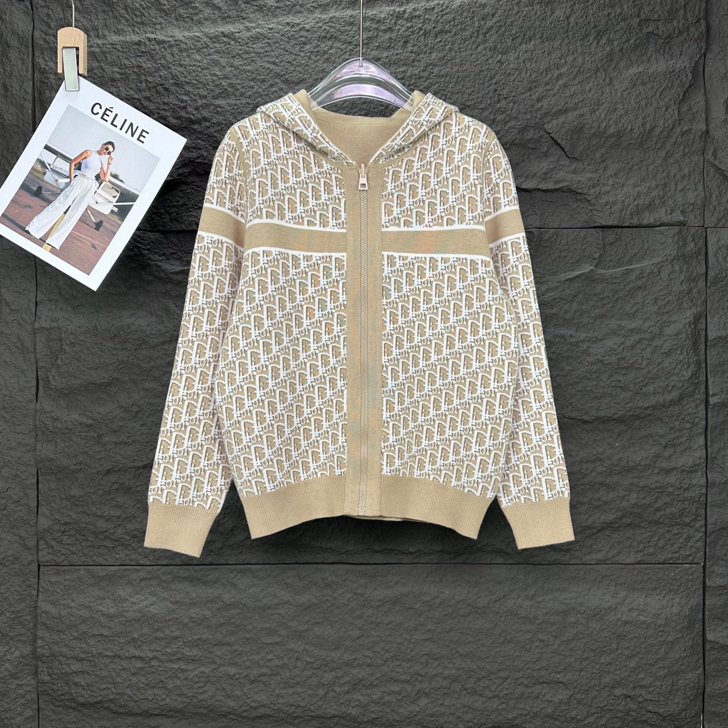 Beige knit hooded zip jacket with allover white monogram pattern, long sleeves