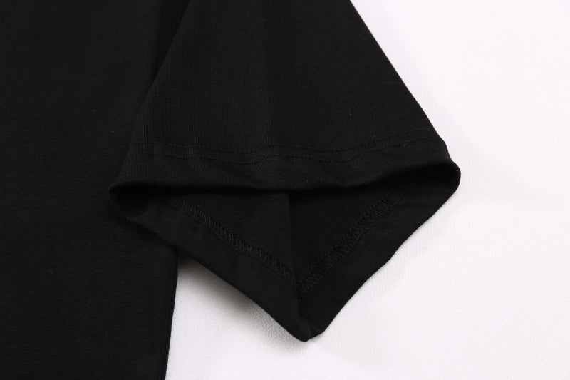 Black T-shirt sleeve and curved hem with neat stitching