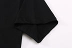 Black T-shirt sleeve and curved hem with neat stitching