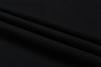 Black T-shirt fabric close-up showing smooth knit texture