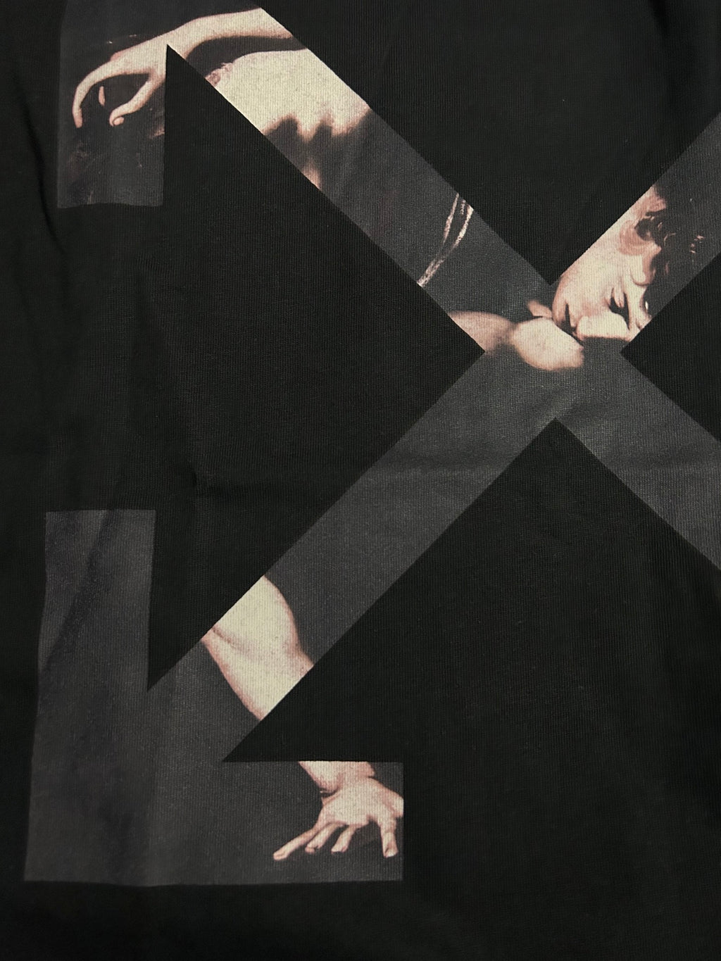 Black Off-White T-shirt with large X graphic and hands illustration