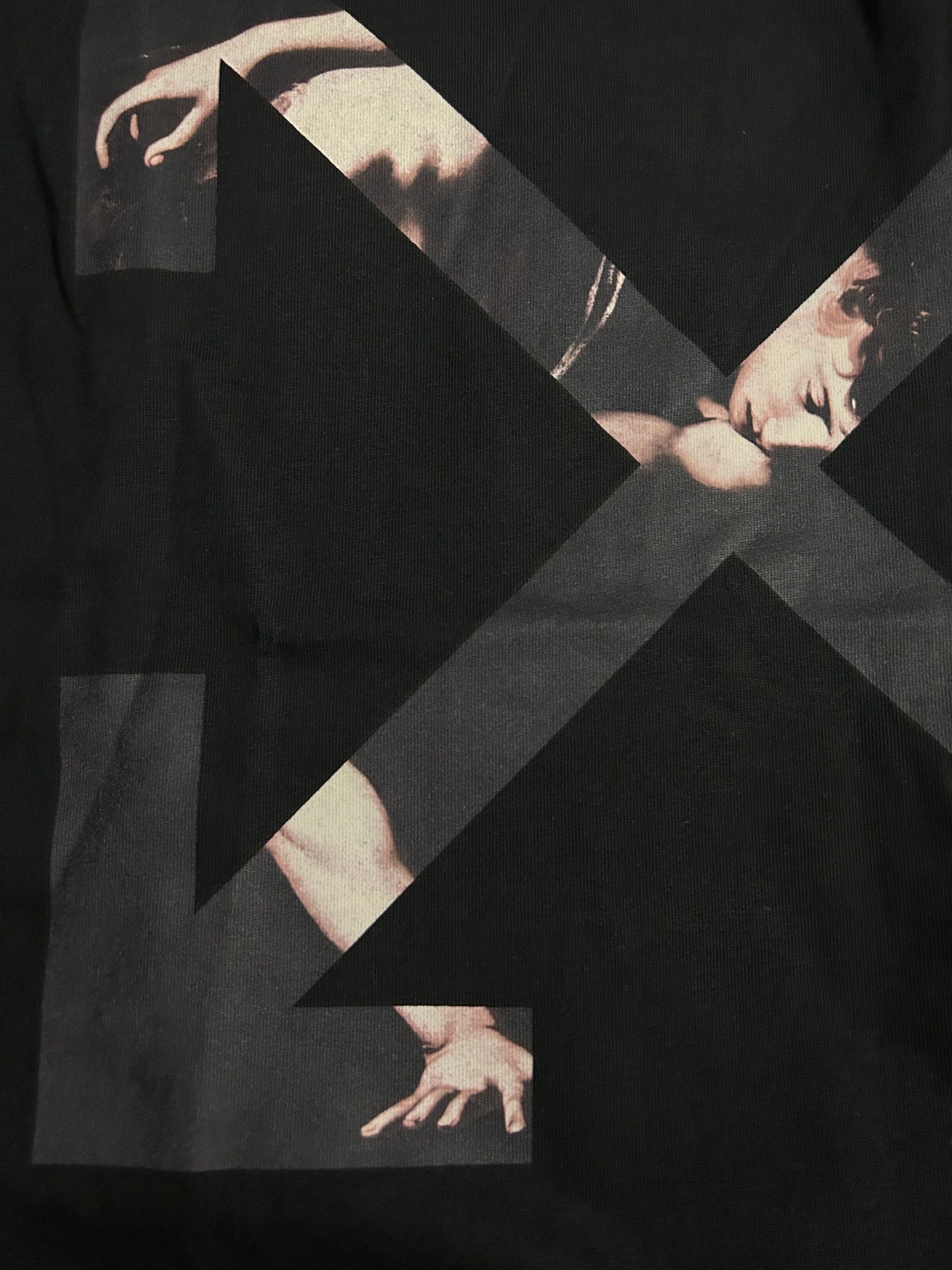 Black Off-White T-shirt with large X graphic and hands illustration