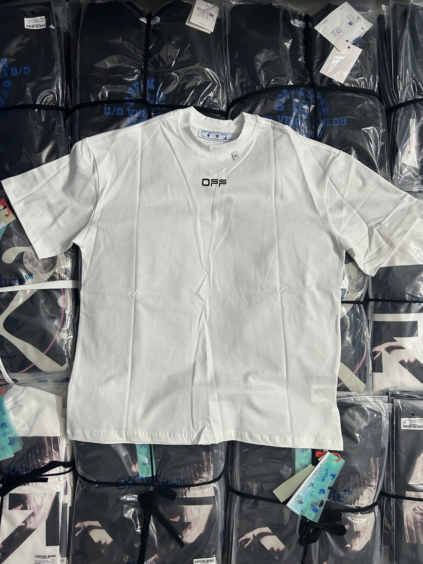 Off-white T-shirt with small OFFS logo at center chest