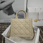 Beige quilted tote bag with top handles and diamond stitch pattern
