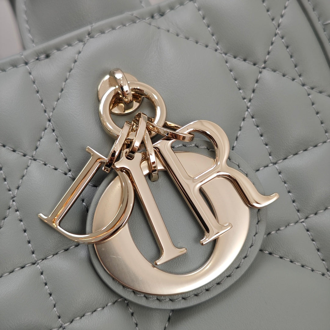 Dior charm on quilted leather, light blue with gold-tone clasp hardware