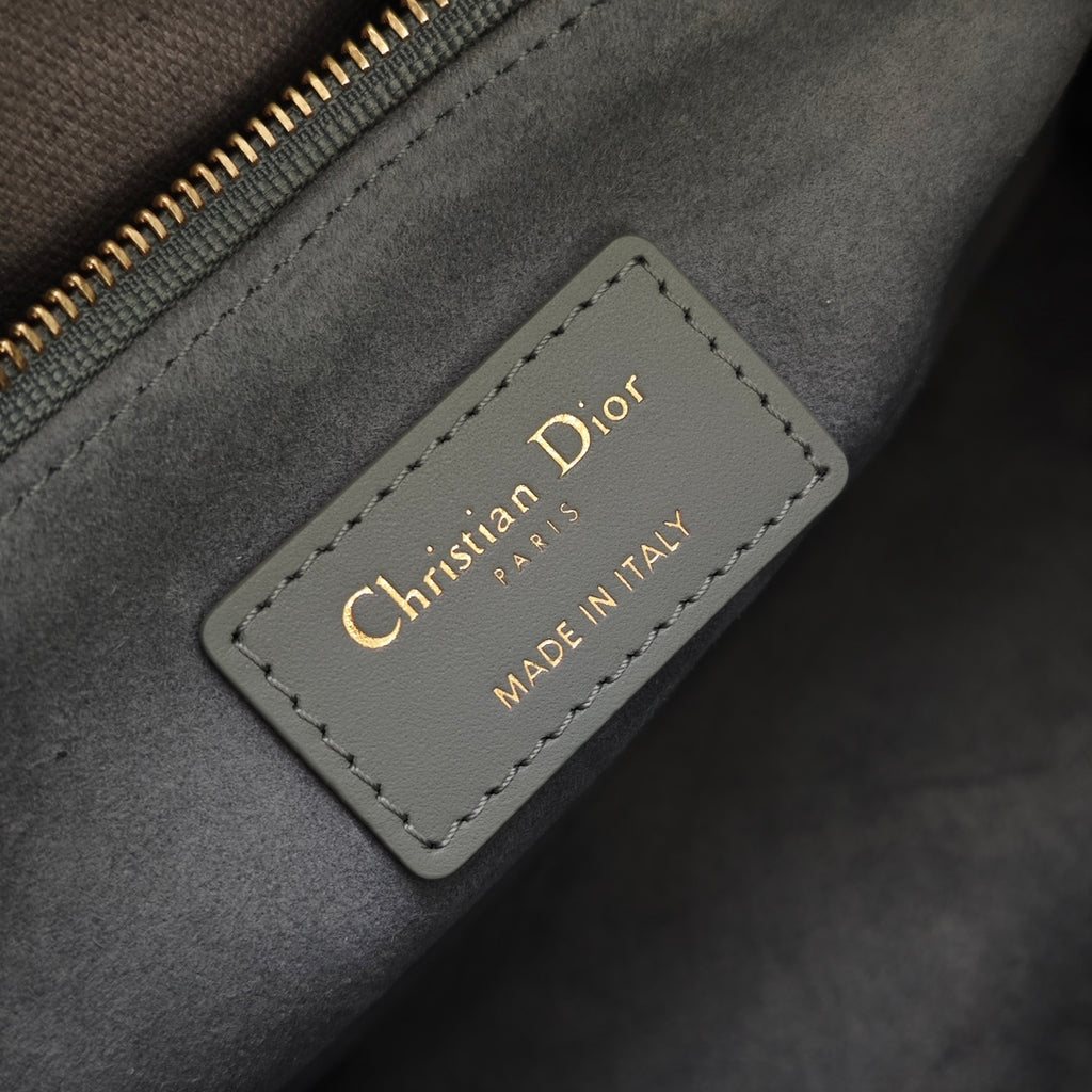 Dior interior label reading Christian Dior and Made in Italy on gray fabric