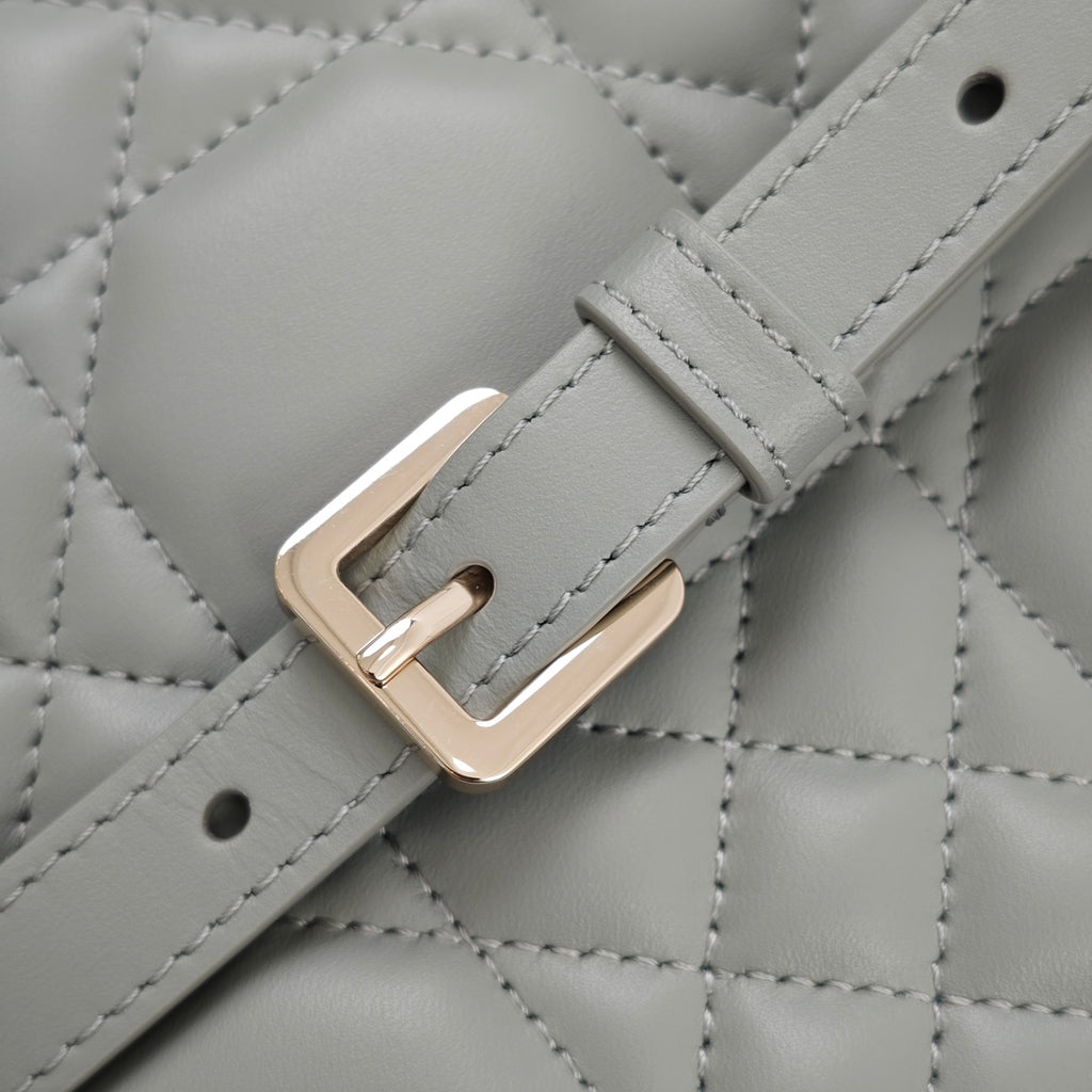 Dior quilted strap buckle with gold-tone metal, light blue
