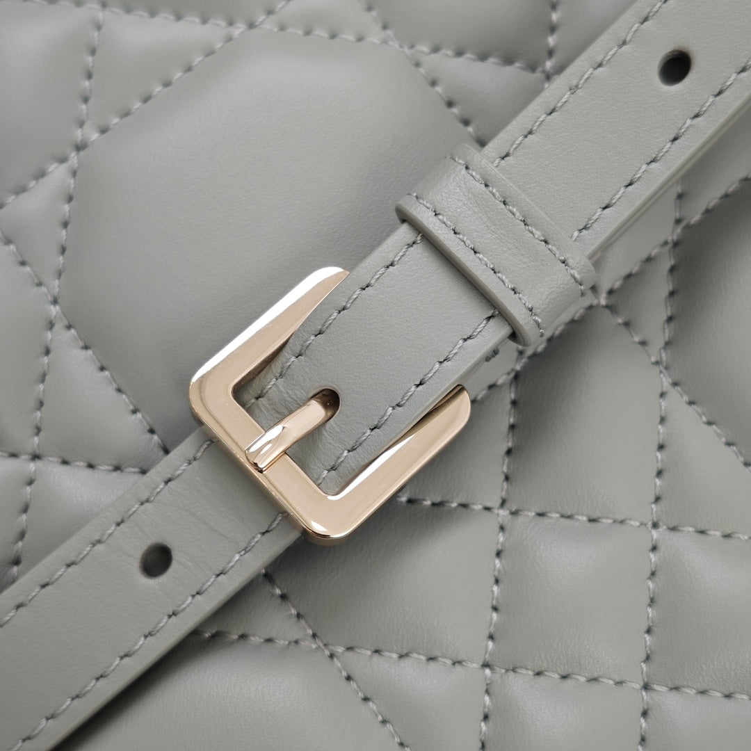 Dior quilted strap buckle with gold-tone metal, light blue