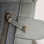 Dior zipper and small hardware detail on quilted light-blue bag interior