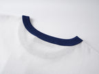 White short-sleeve T-shirt with navy ribbed collar trim