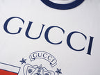 White short-sleeve T-shirt with large GUCCI lettering and crest graphic