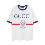 White short-sleeve T-shirt with navy ribbed collar, GUCCI logo and crest print