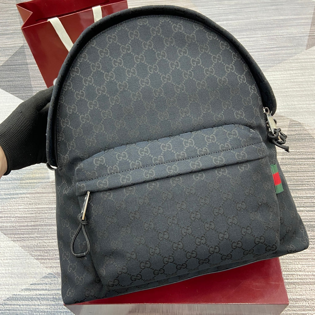Monogram mini backpack with curved top and front zipper pocket