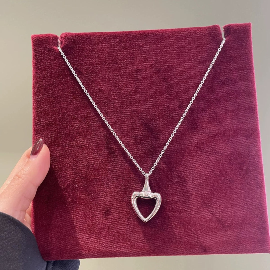 Gucci heart pendant necklace with thin silver chain and small heart charm