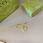 Gold-tone heart pendant necklace with layered chain and small clasp hardware