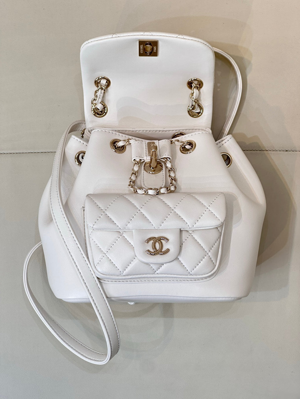 Chanel leather mini flap bag with chain strap, front CC logo, and top handle