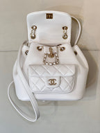 Chanel leather mini flap bag with chain strap, front CC logo, and top handle