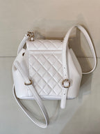 Chanel quilted leather mini backpack-style bag with chain accents and gold-tone hardware