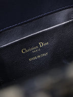 Dior bag interior label with gold "Christian Dior Paris" and "Made in Italy"