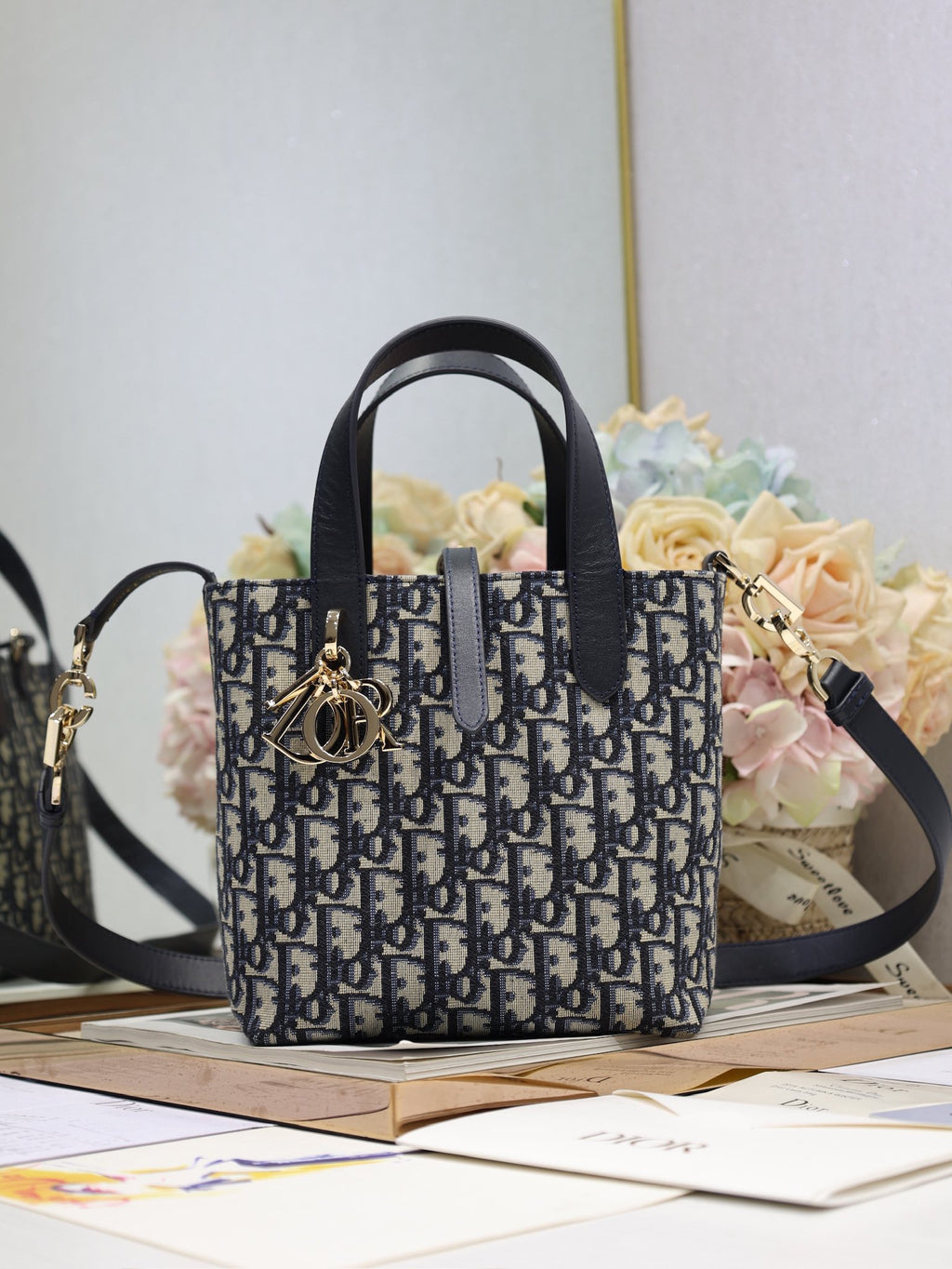 Dior small tote bag with navy Dior Oblique canvas and black leather handles
