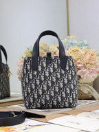 Dior small top-handle tote bag with navy Dior canvas and black leather trim