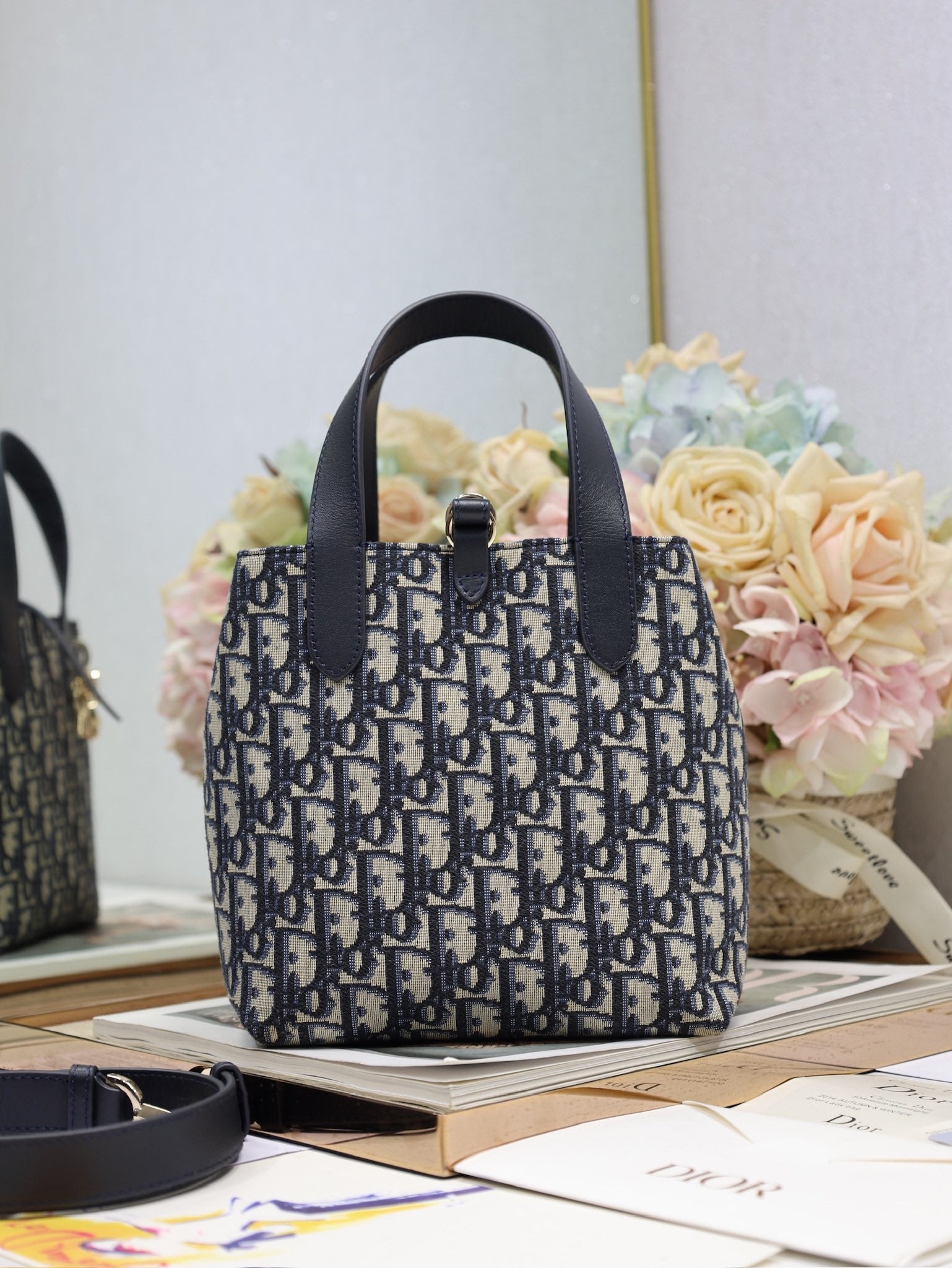 Dior small top-handle tote bag with navy Dior canvas and black leather trim