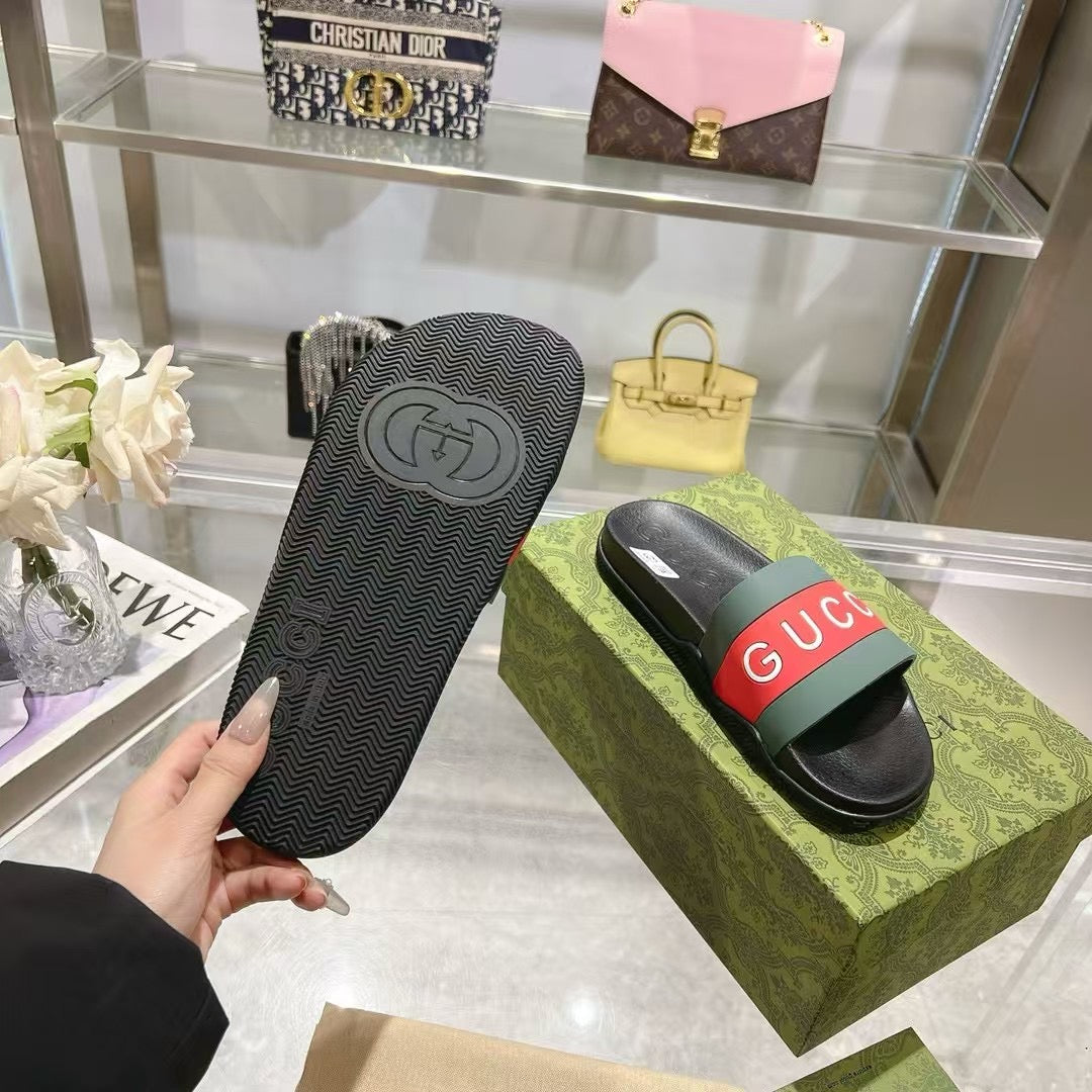 Black Gucci slide sandal sole with circular logo emblem