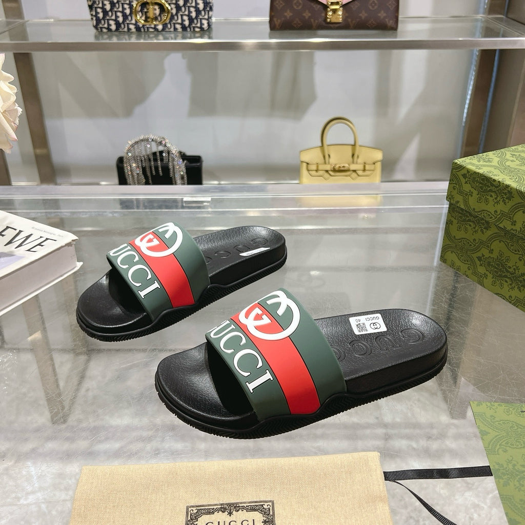 Gucci slide sandals pair, black footbed with green-red logo strap and contrasting band