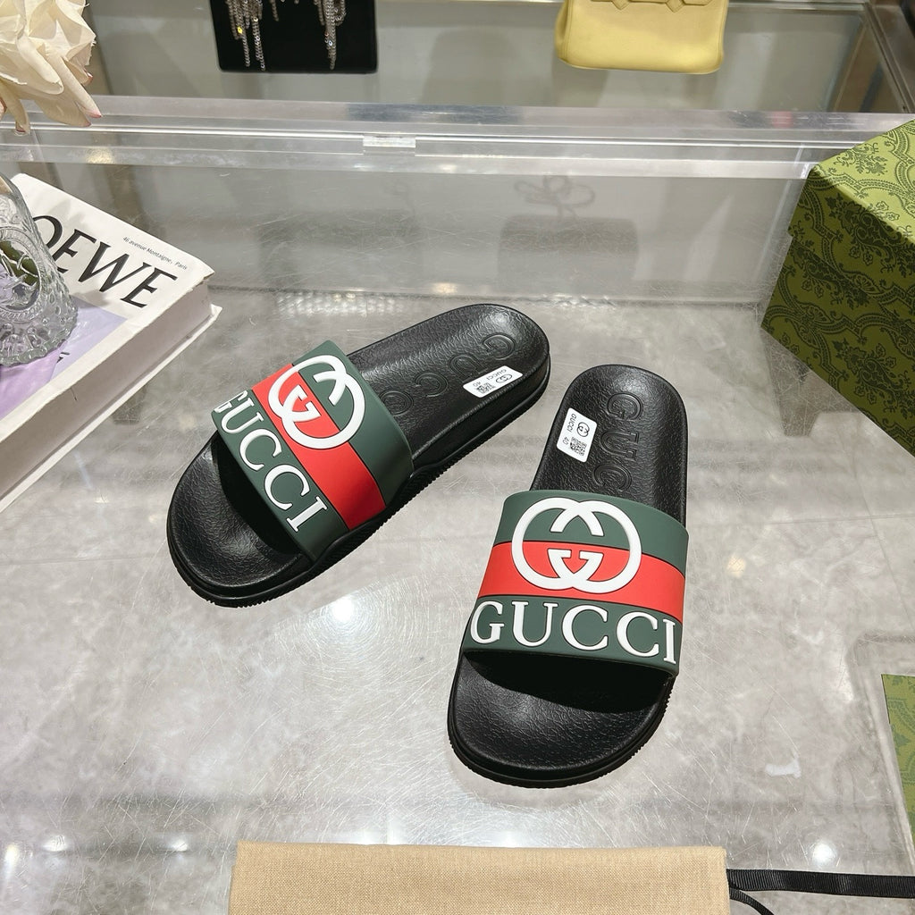 Gucci slide sandals, black footbed with green and red striped strap and white logo