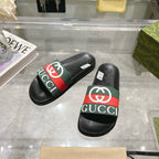 Gucci slide sandals, black footbed with green and red striped strap and white logo