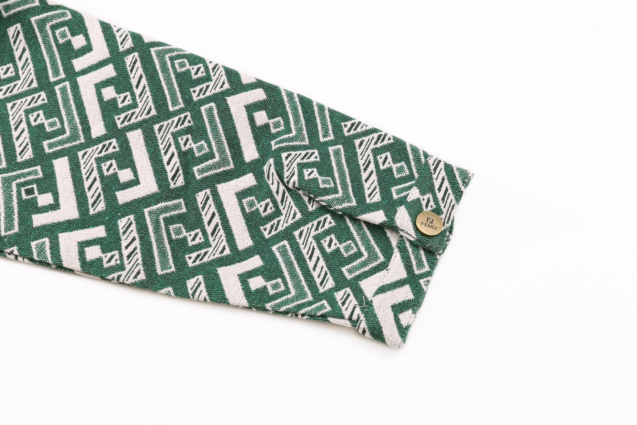 Fendi green patterned shirt sleeve with buttoned cuff and geometric motif