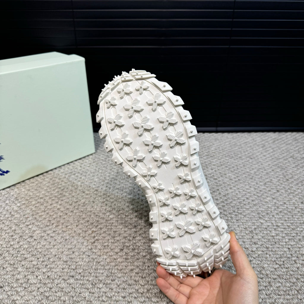 Burberry white studded outsole sole segment held in hand