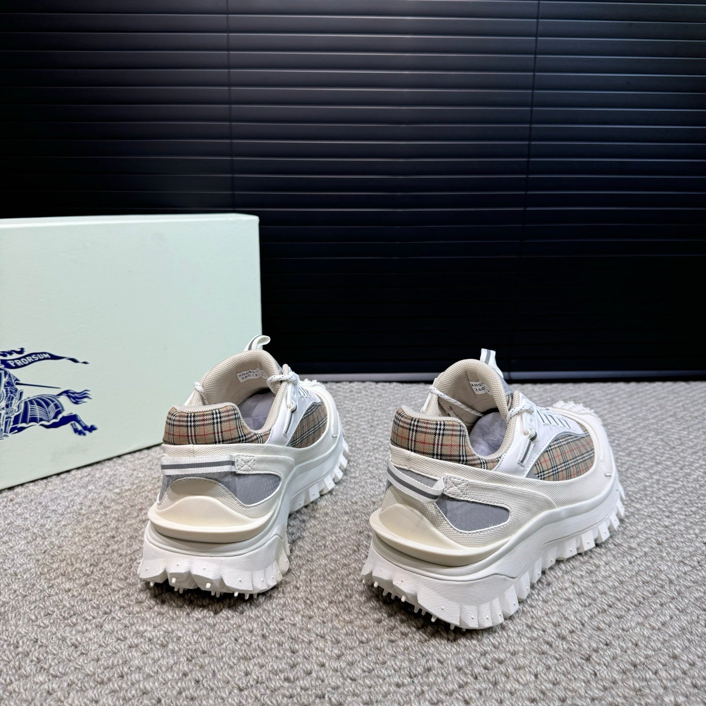Burberry white sneakers heel view with plaid lining and chunky lug outsole