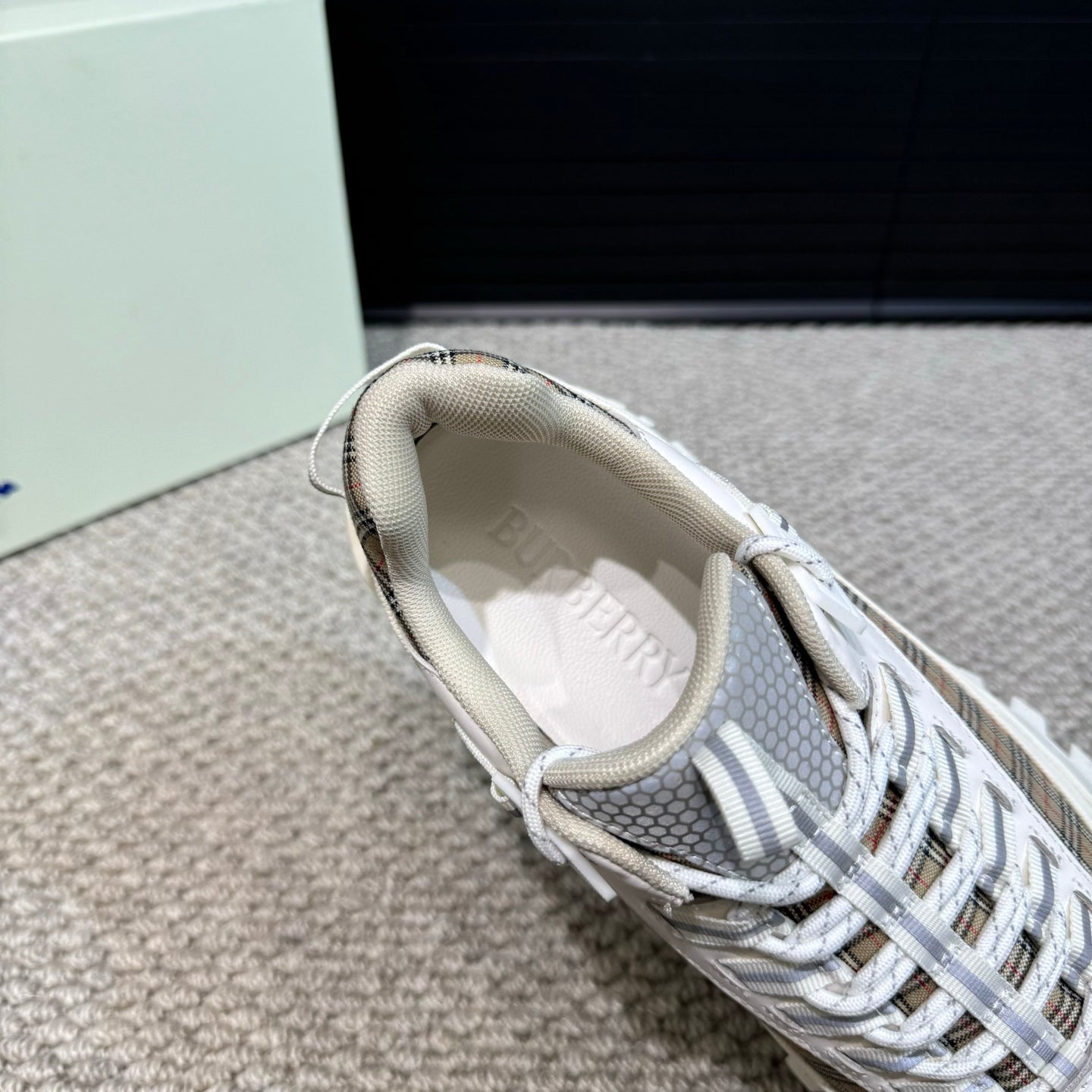 Burberry white sneaker interior with lace-up collar and plaid trim