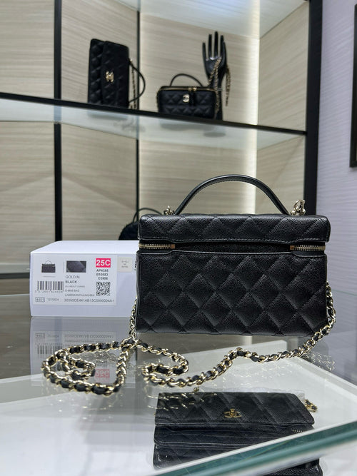 Black quilted Chanel satchel handbag with top handle, chain strap, and front flap