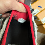 Shoe interior label with BALENCIAGA text on red and black fabric