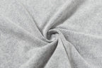 Light gray T-shirt fabric close-up with soft folds