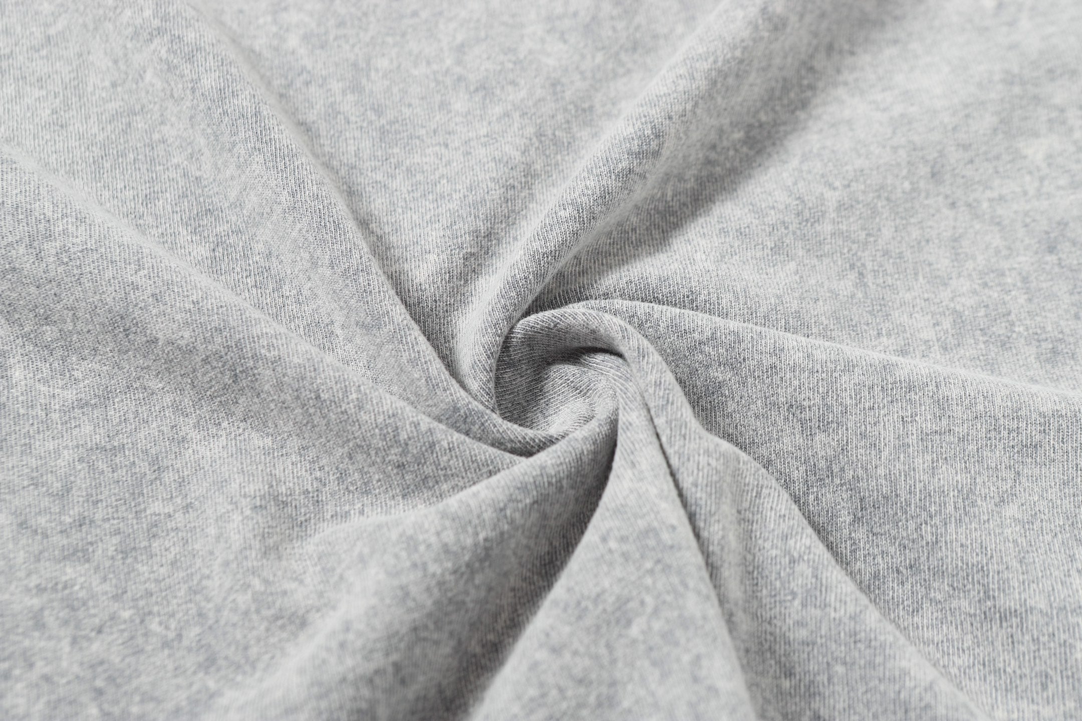 Light gray T-shirt fabric close-up with soft folds