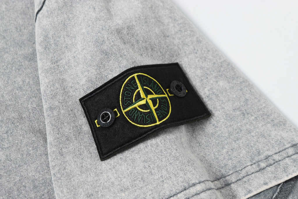 Stone Island logo patch on light gray sleeve
