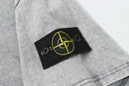 Stone Island logo patch on light gray sleeve